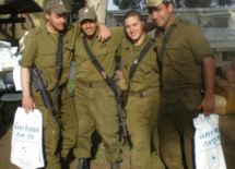 Members of the Venus Tank Unit mug for the camera after receiving their Purim gifts.